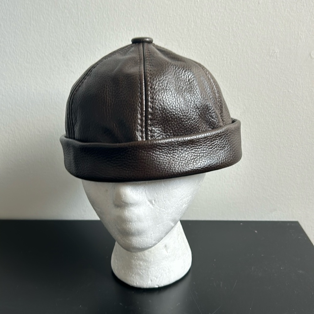 Brown Imitation Leather Cap .